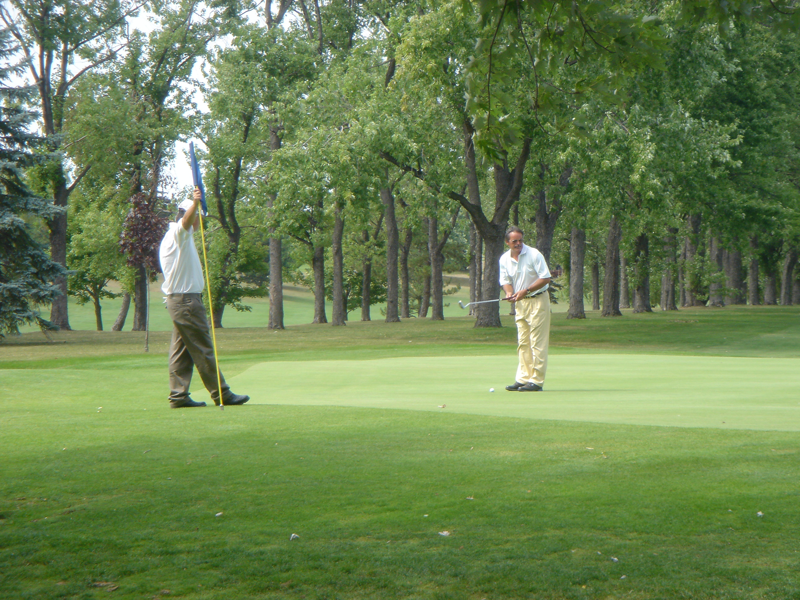 John and Bill Lindner on 18th green