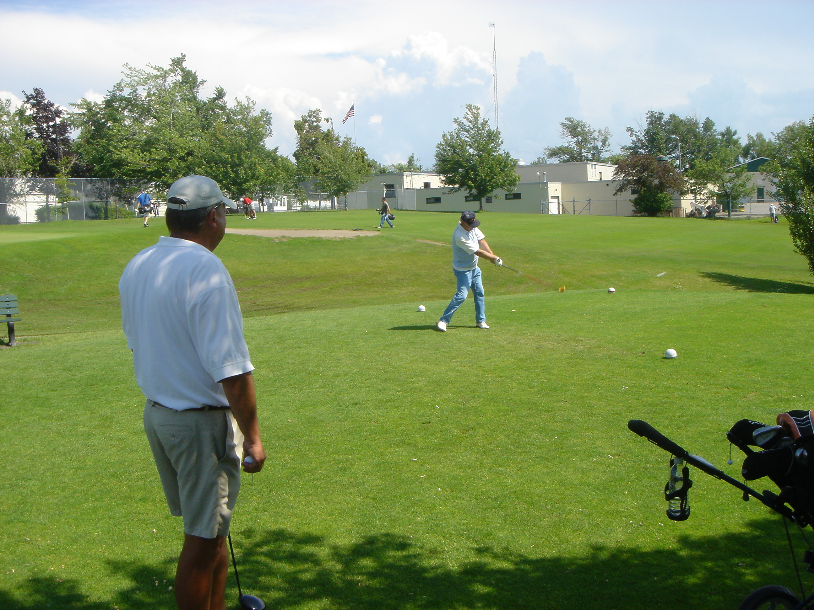 80 Year Old Club Icon Ed "Smitty" Smith Tees off on 18th Hole with his Persimmon Driver while Jim Schreck Watches During Their 21-Hole President's Cup Match on June 22, 2008